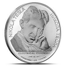 silver coin with an image of tesla on one side and the Tesla Coil on the other side